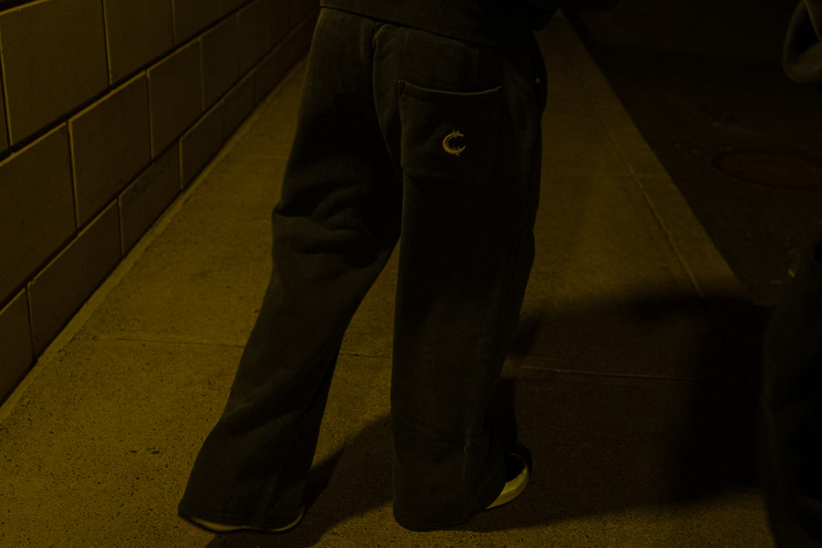 The Dawn flared sweatpant mid-stride, the flare opening over the foot