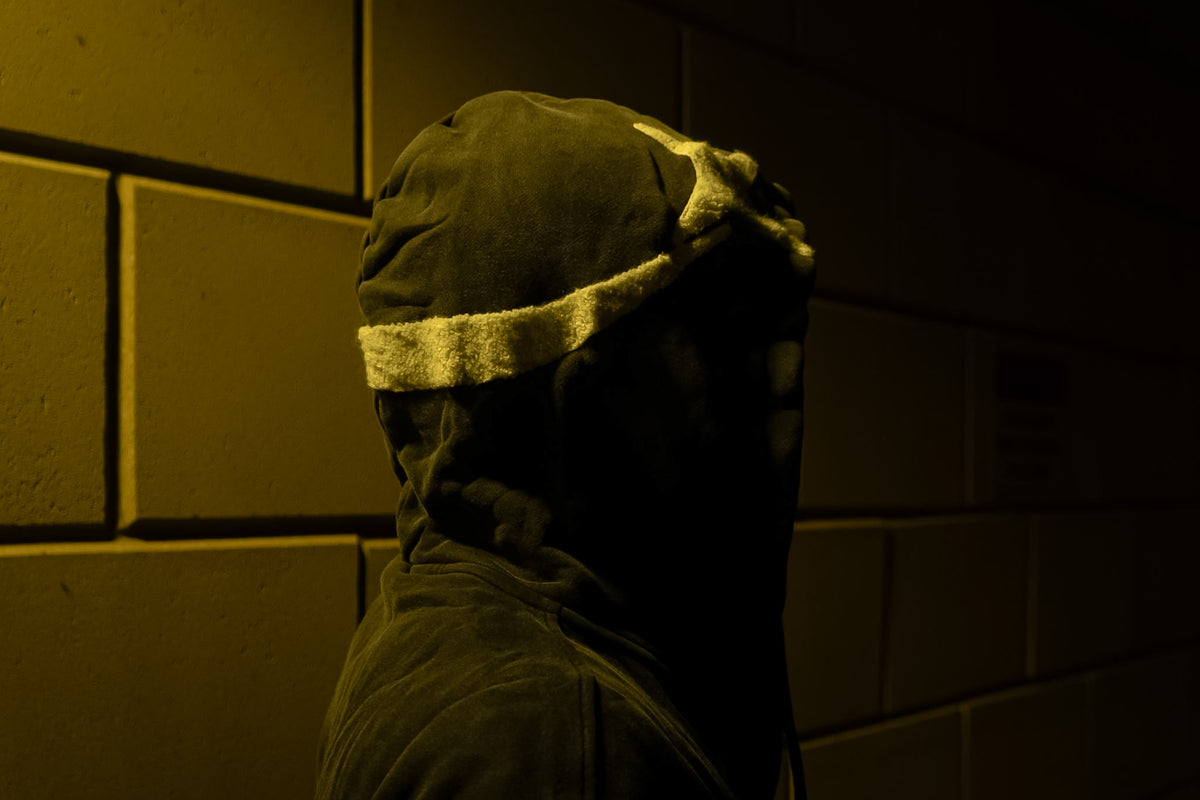 The hood of the Dawn zip-up in profile, light along its edge